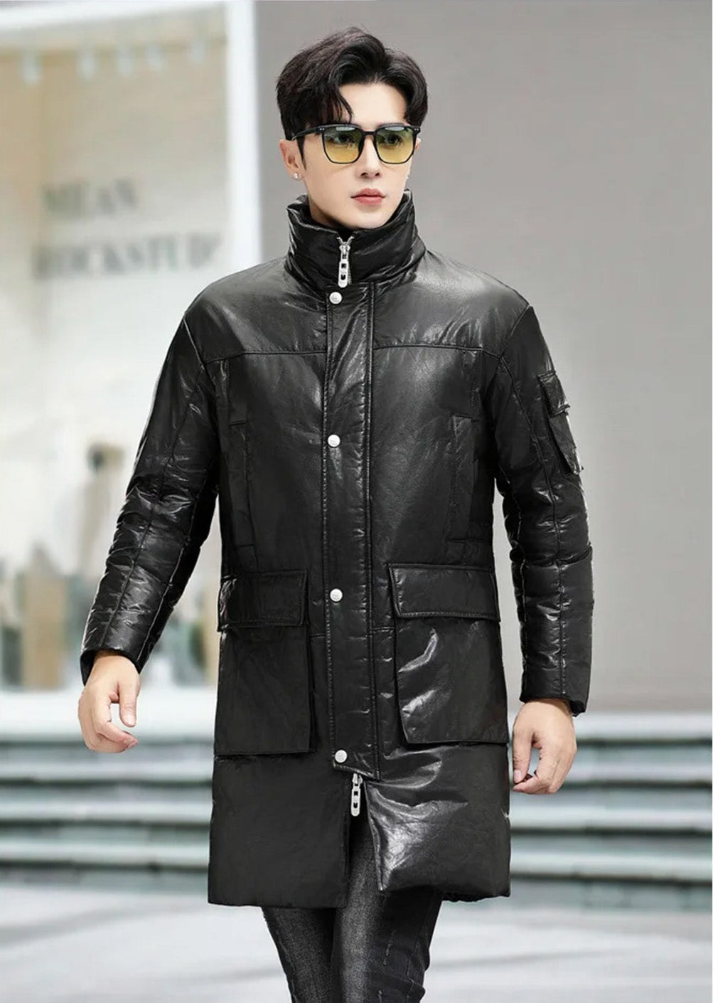Model walking forward in the men’s cowhide coat with cargo pockets in Onyx — From Borcelleclothes.