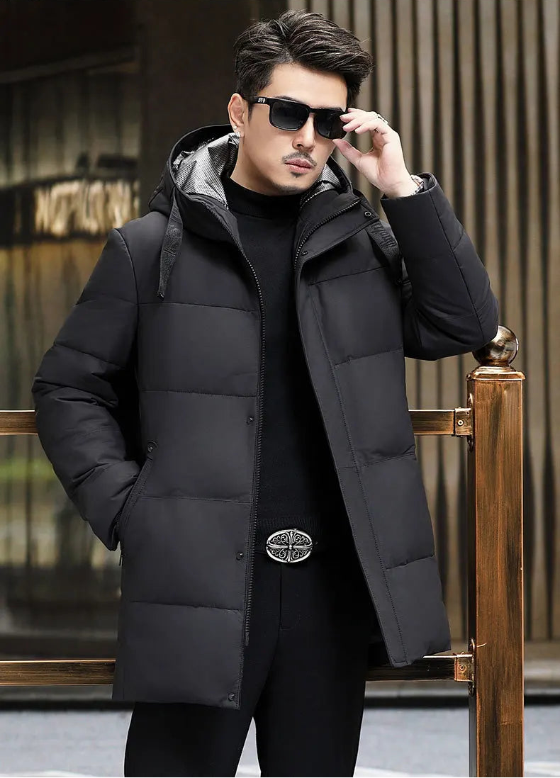 Model adjusting sunglasses in the Abyss down coat with hood belt — From Borcelleclothes.