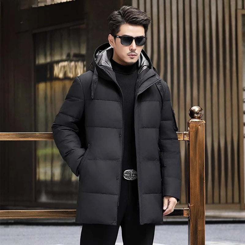 Men's Matte cowhide down coat in Abyss, featuring  a wide hood belt, reflective lining, and concealed placket. From Borcelleclothes.