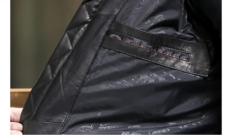 Interior lining of the Onyx cowhide down coat with soft tonal padding and glossy texture. — From Borcelleclothes.