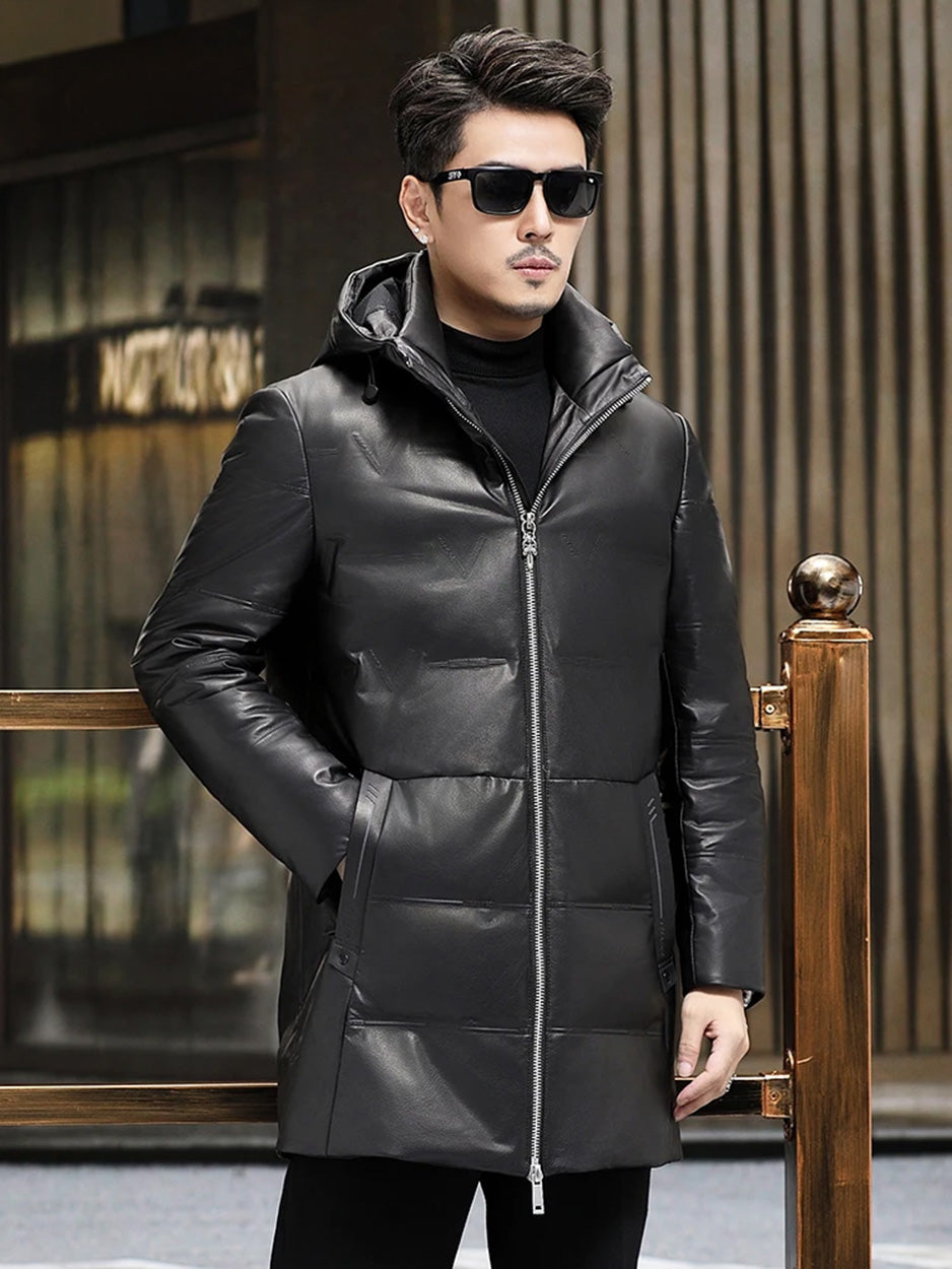 Model in Onyx cowhide down coat with hand in pocket, showing embossed detailing and coat volume. — From Borcelleclothes.