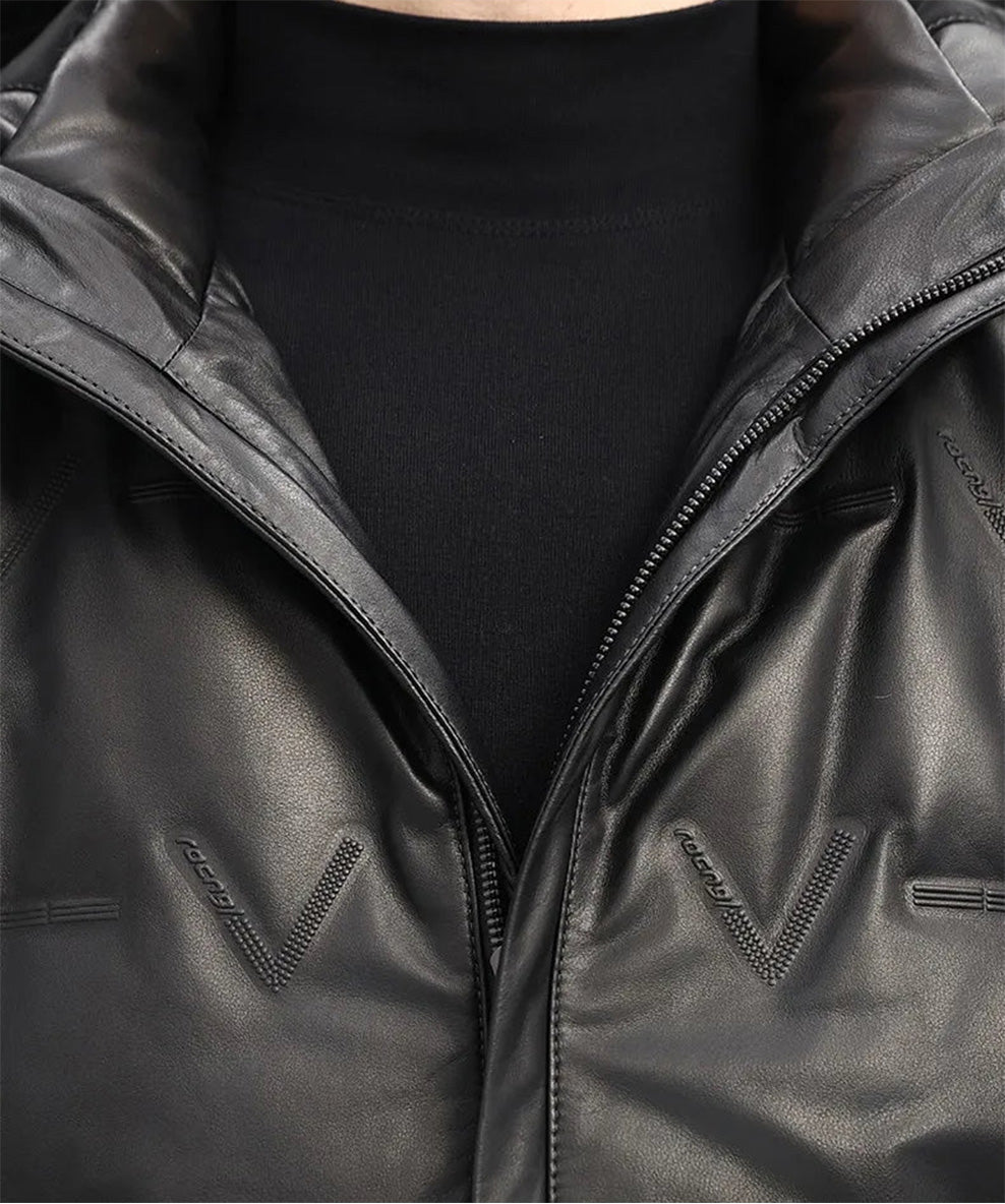 Detailed view of the unzipped collar of the cowhide down coat in Onyx with curved edge and textural contrast. — From Borcelleclothes.