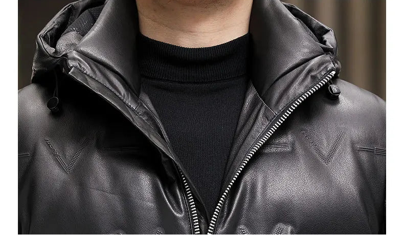 Detailed view of the unzipped collar of the cowhide down coat in Onyx with curved edge and textural contrast. — From Borcelleclothes.