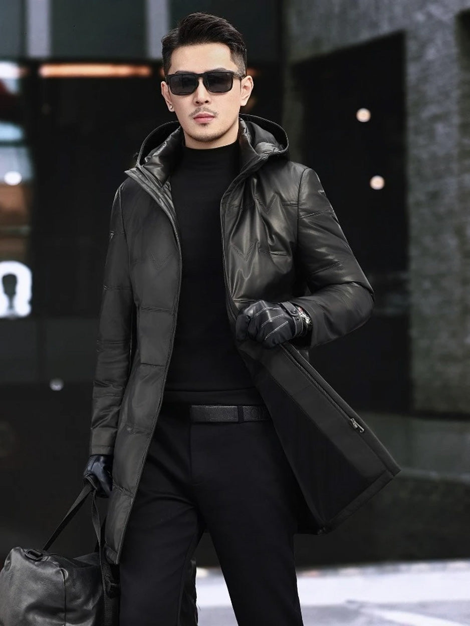 Model wearing an Onyx cowhide down coat, walking forward. — From Borcelleclothes.