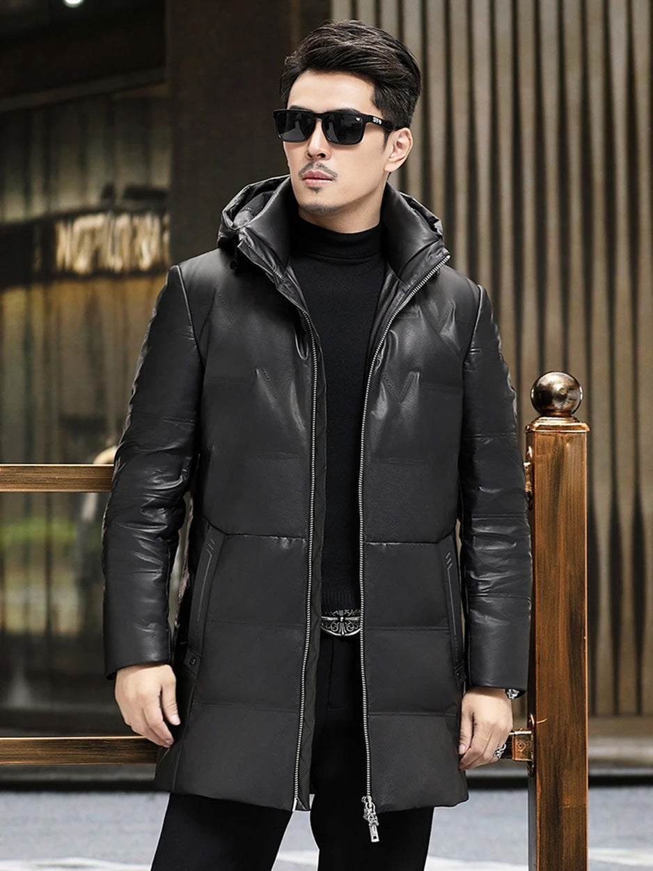 Men’s down coat in embossed cowhide leather, Onyx color. Hood with drawcord and metal puller, geometric pocket details, structured silhouette — From Borcelleclothes.