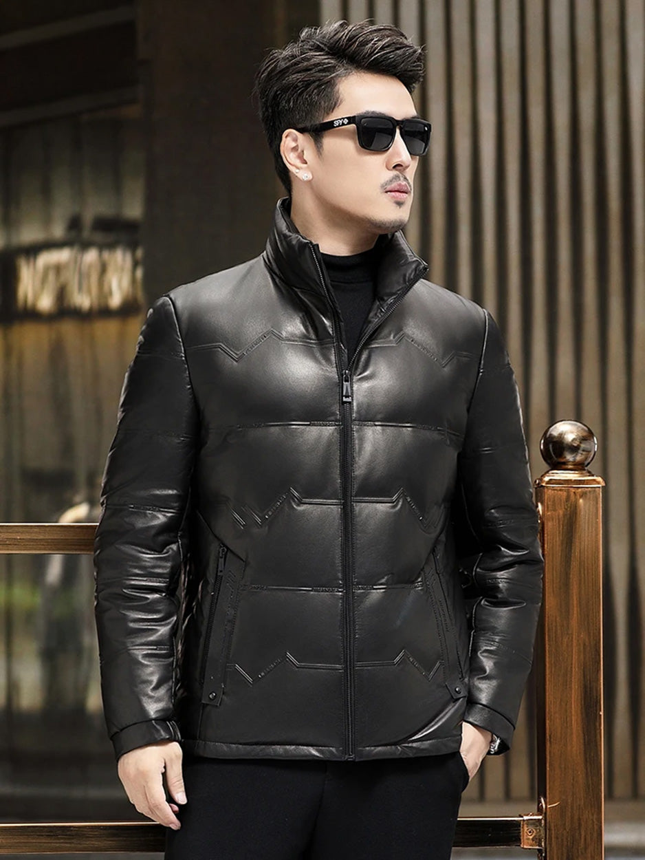 Model, wearing a cowhide jacket with embossed zigzag and lettering details, looking to the side— From Borcelleclothes.