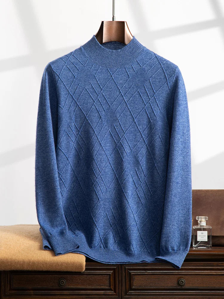 Men’s cashmere sweater in Dusky Blue, with a diamond-stitch pattern across the chest; each rhombus contains a cross-shaped structure with a central purl-knit center — From Borcelleclothes.