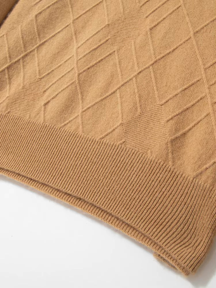Bottom part of the men’s diamond-stitch cashmere sweater in Lion, showing texture and straight silhouette — From Borcelleclothes.