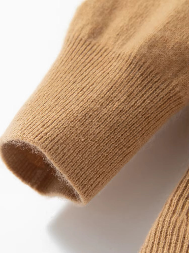 Close-up of cuff on the men’s diamond-stitch cashmere sweater in Lion color, in elastic rib texture — From Borcelleclothes.