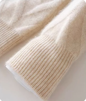 The ribbed sleeve hem on the Men's Dimensional Abstract Sprouts Wool Sweater in Almond, emphasizing its polished finish. From Borcelleclothes.