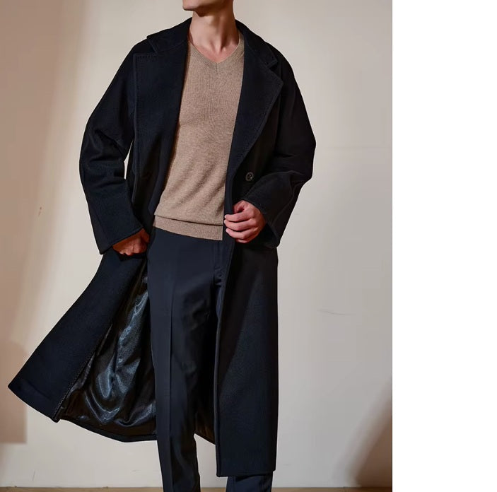 Model in the Men’s Double-Breasted Belted Cashmere Coat in Black Pearl, moving to reveal the smooth lining and soft cashmere-wool blend. From Borcelleclothes.