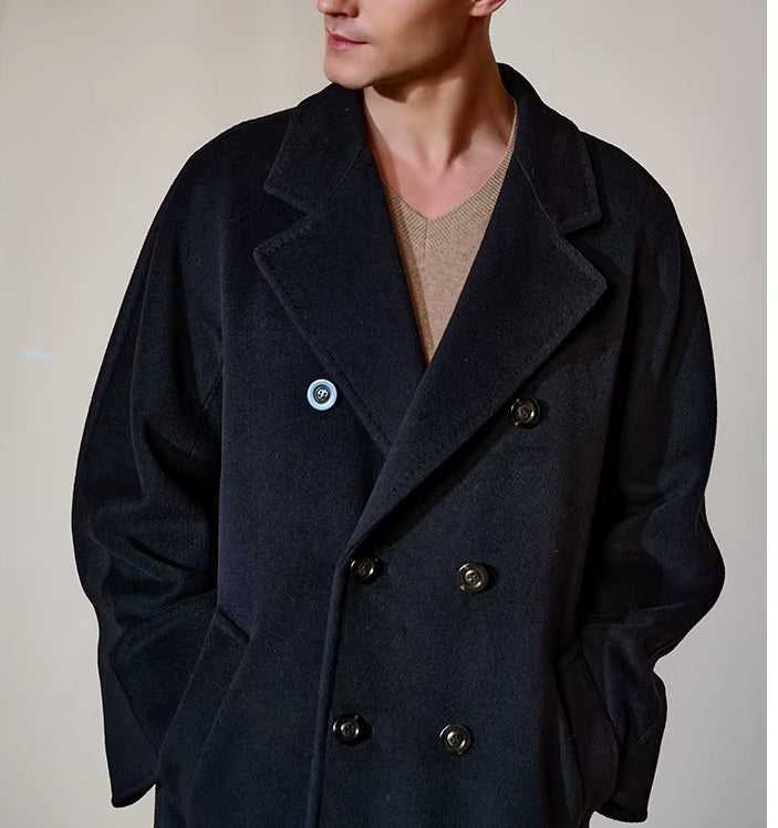 Model wearing the Men’s Double-Breasted Belted Cashmere Coat in Black Pearl, focusing on the upper part, emphasizing refined craftsmanship and luxurious texture. From Borcelleclothes.