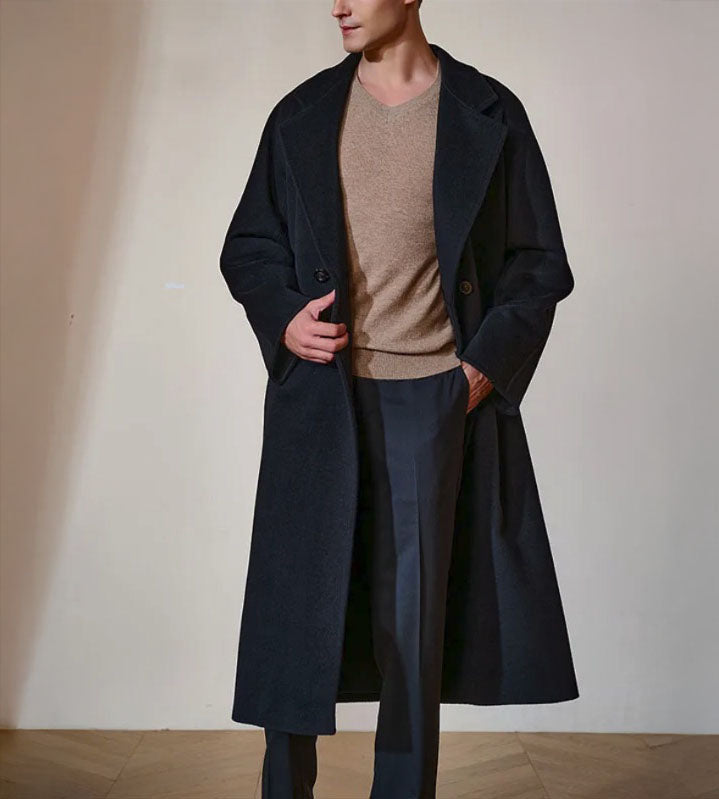 Men’s Double-Breasted Belted Cashmere Coat in Black Pearl, crafted from a luxurious blend of 70% cashmere and 30% high-count wool. Featuring a structured yet fluid silhouette, six-button front, adjustable belt, and sculpted sleeve construction. From Borcelleclothes.