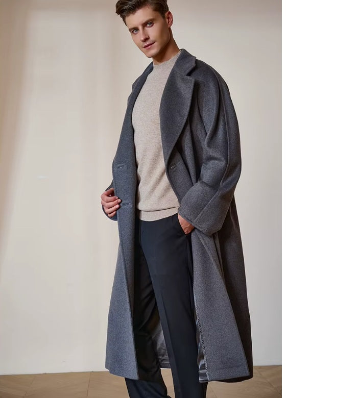 Model wearing the Men’s Double-Breasted Belted Cashmere Coat in Bright Grey, unbuttoned and slightly turned to the side, showcasing its natural movement. From Borcelleclothes.