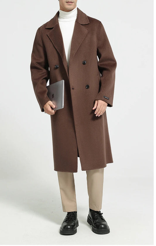 Men’s double-faced wool coat in Espresso, double-breasted, with notch lapels—model holding a notebook. From Borcelleclothes.
