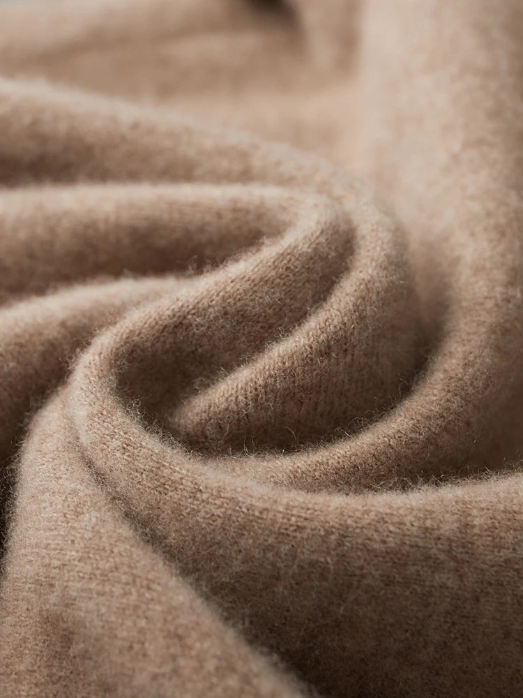 Spiral-folded demo of men’s double-knit cashmere sweater in Beigewood, revealing soft surface and thickness — From Borcelleclothes.