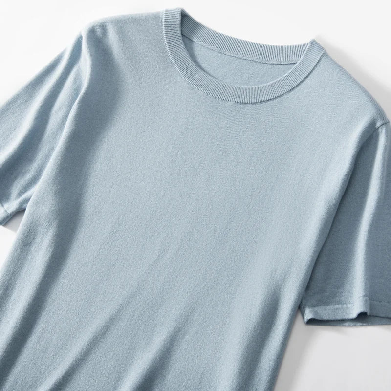 Upper part of the Men’s fine-knit silk-cashmere T-shirt in Jungle Mist — lightweight and breathable knit with a smooth surface, ribbed neckband, and bottom hem. From Borcelleclothes.