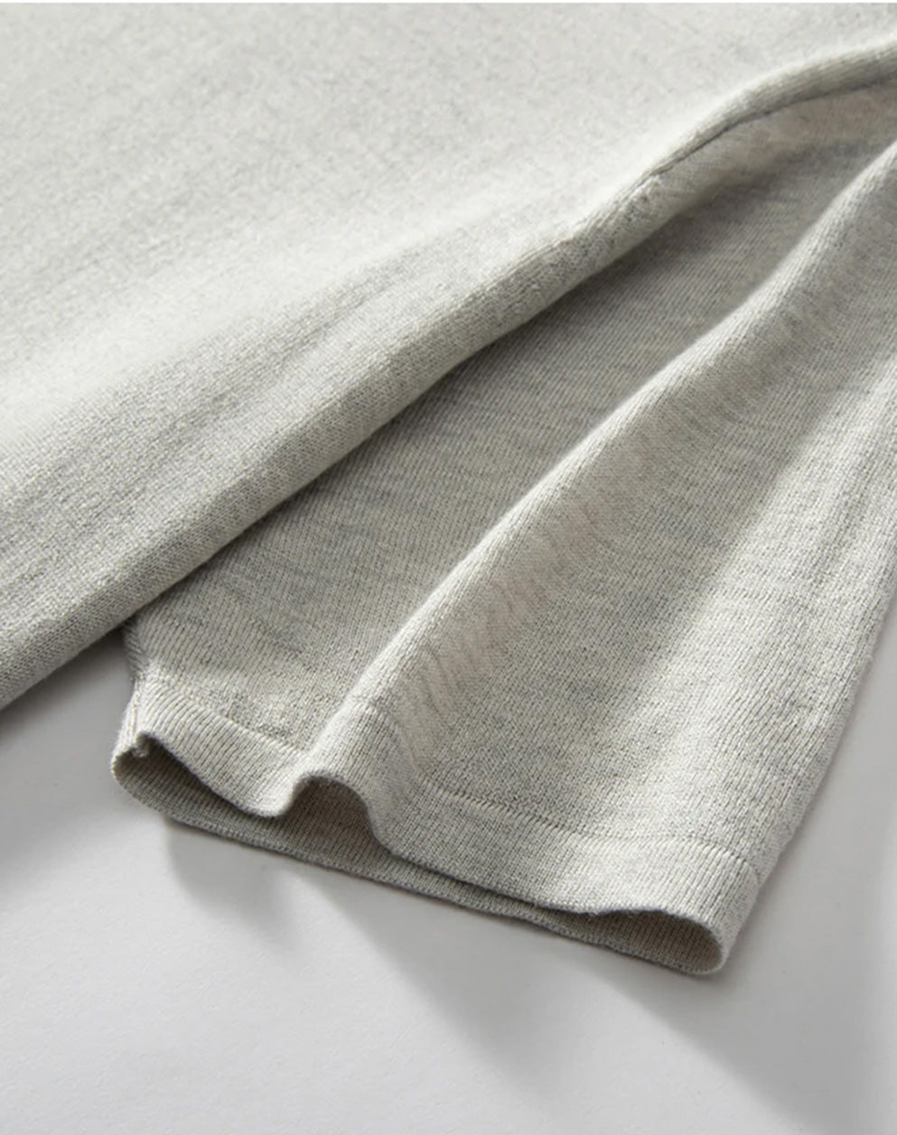 Men’s fine-knit silk-cashmere T-shirt in Silver Sand – close-up of the short sleeve showing supple drape and fine finish. From Borcelleclothes.