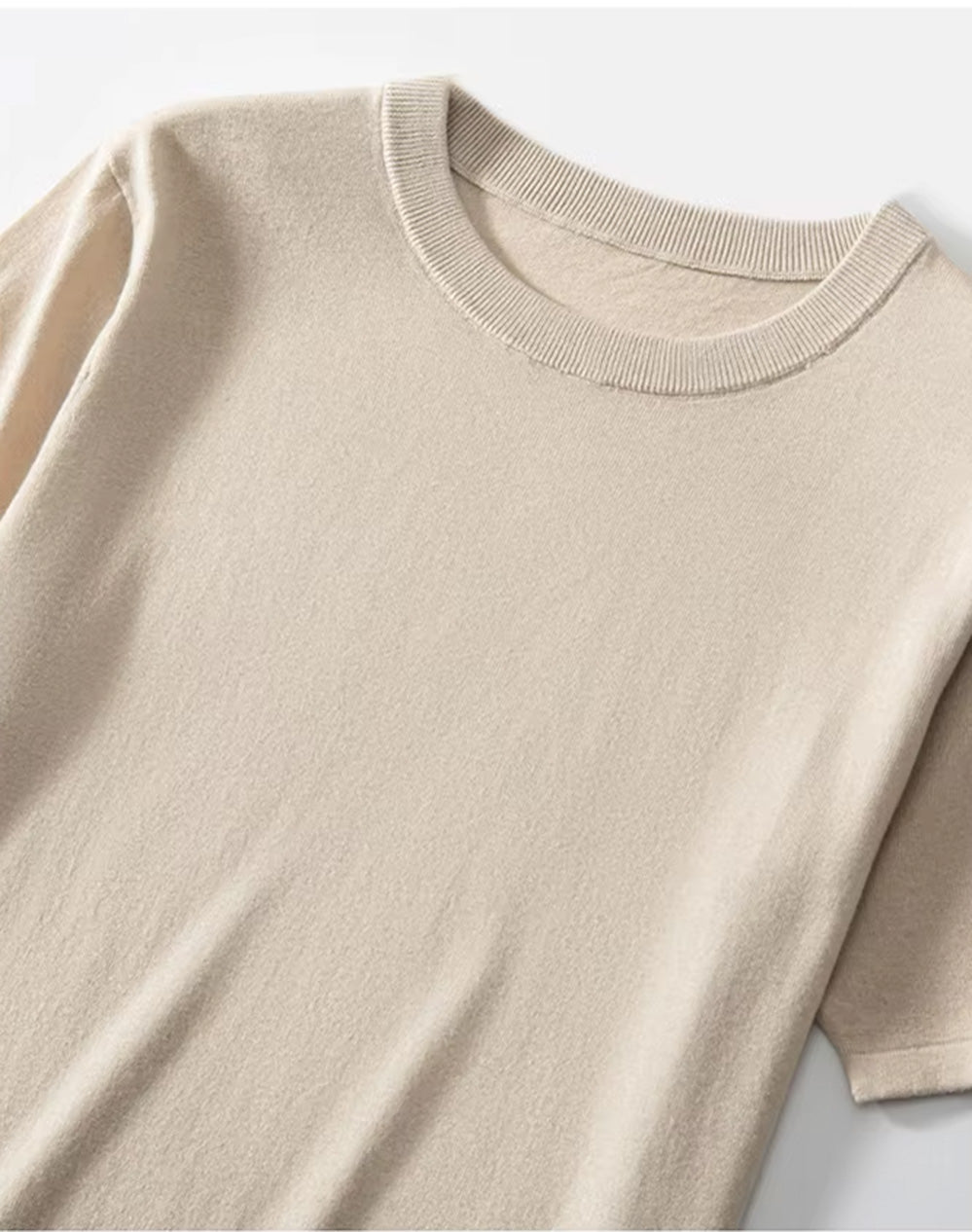 Upper part of the Men’s fine-knit silk-cashmere T-shirt in Soft Amber — lightweight and breathable knit with a smooth surface, ribbed neckband, and bottom hem. From Borcelleclothes.