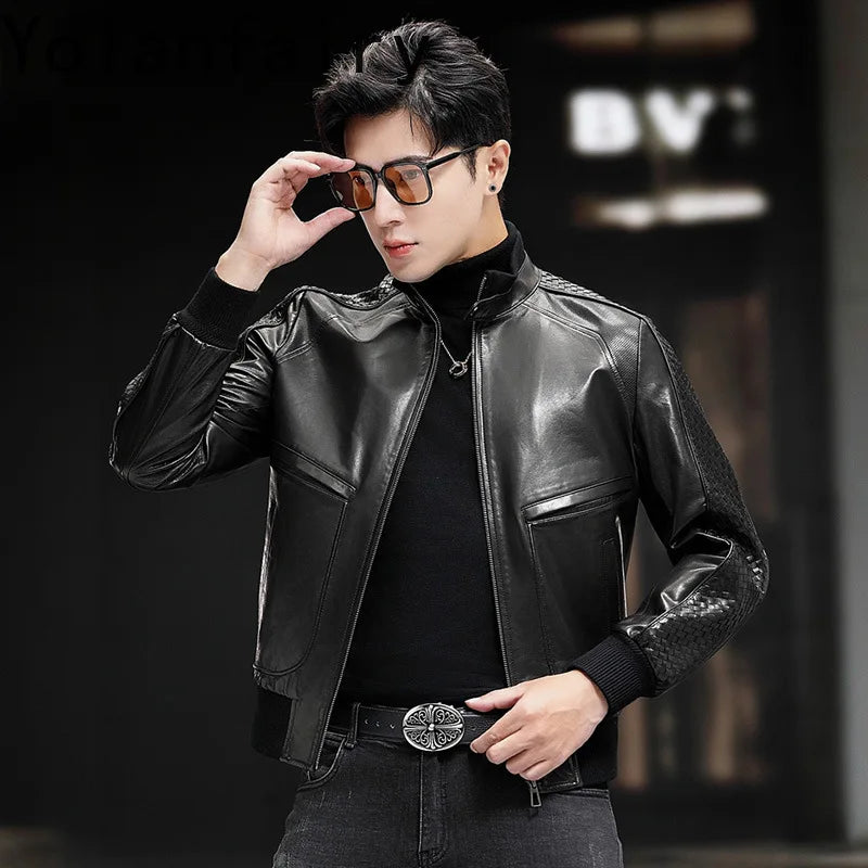 Model adjusts glasses while wearing men’s goatskin jacket with woven overlays and metal zip in Onyx — From Borcelleclothes.