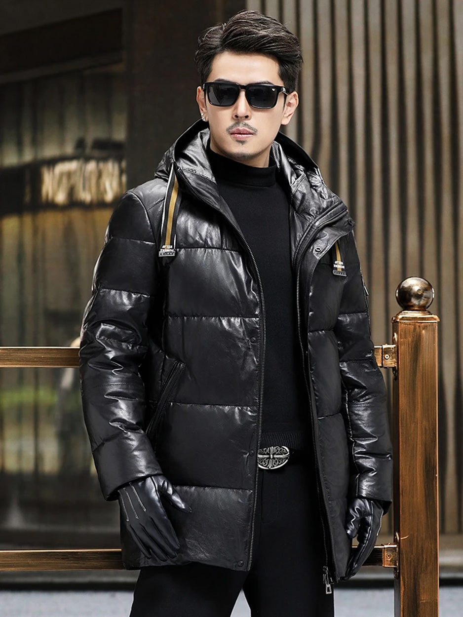 Front view, model standing straight in men’s Onyx goatskin down coat with hood belt — From Borcelleclothes.