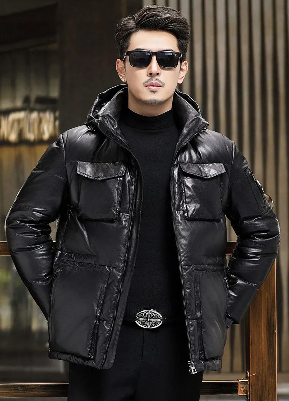 Goatskin down jacket in Onyx, unzipped, model with both hands behind back — From Borcelleclothes.