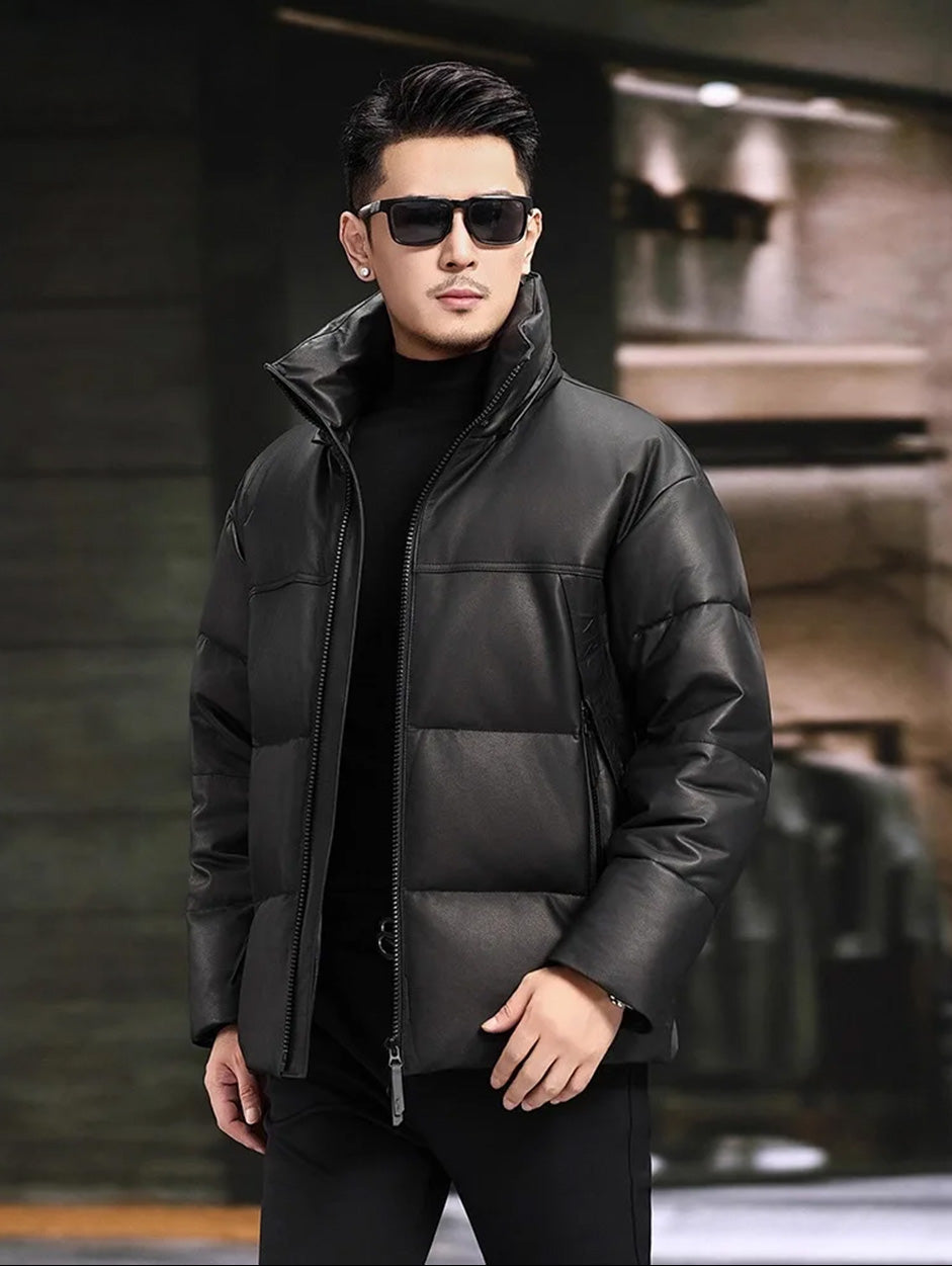 Men’s goose down jacket in matte cowhide, shown in motion with hood and vertical zip pockets — From Borcelleclothes.