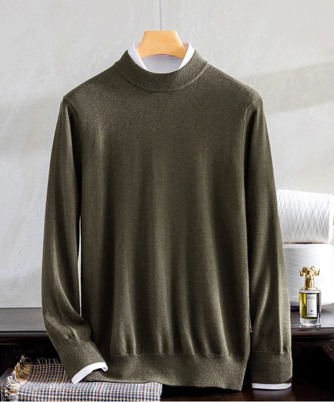 Fluid draping of a Men's Grade A Alashan Cashmere Mock Neck Sweater in Makara, crafted from 100% Alashan Cashmere, featuring a smooth stockinette bodice, ribbed mock neck, and ribbed cuffs for a polished and sophisticated look. From Borcelleclothes.