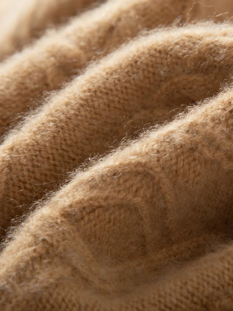 Front panel of the Lion hybrid neck cashmere sweater with cable and geometric motifs in purl stitch — From Borcelleclothes.