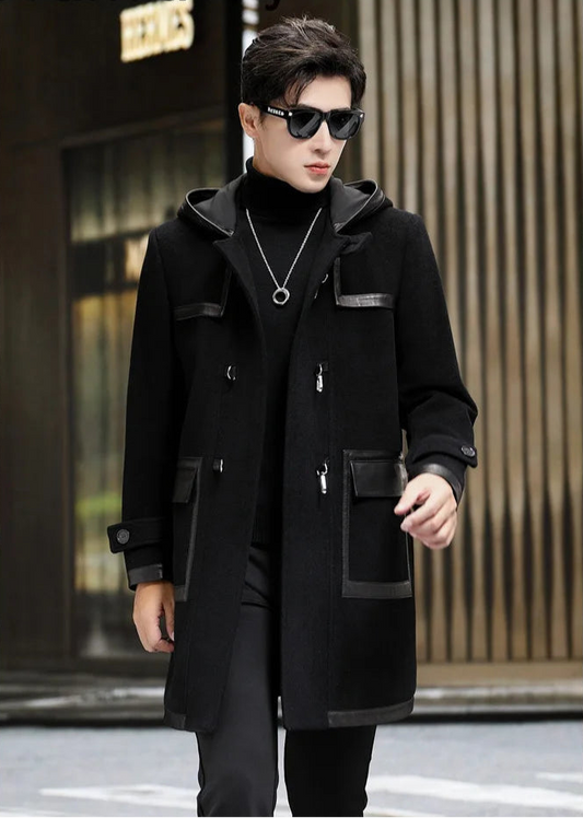 Model walking in an onyx hybrid wool-leather coat, showcasing fluid movement. From Borcelleclothes.