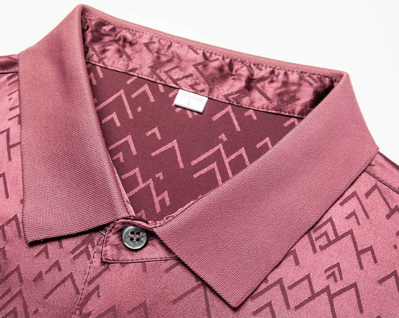 Close view of the Coral Tree polo collar with soft structure and inscribed jacquard lines — a pattern that suggests intention, not ornament. From Borcelleclothes.