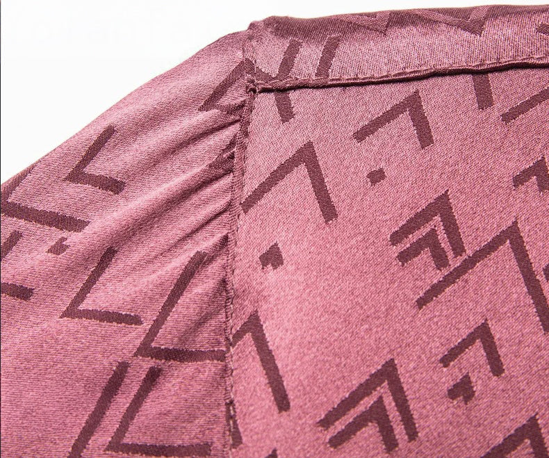 Structured shoulder seam of the Coral Tree silk polo — clean, composed, and reinforced by the quiet geometry of the fabric. From Borcelleclothes.