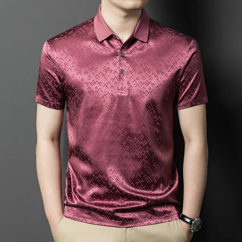 Mulberry silk polo in Coral Tree with inscribed jacquard pattern — warm-toned, softly reflective, and structured with quiet intensity beneath the surface. From Borcelleclothes.