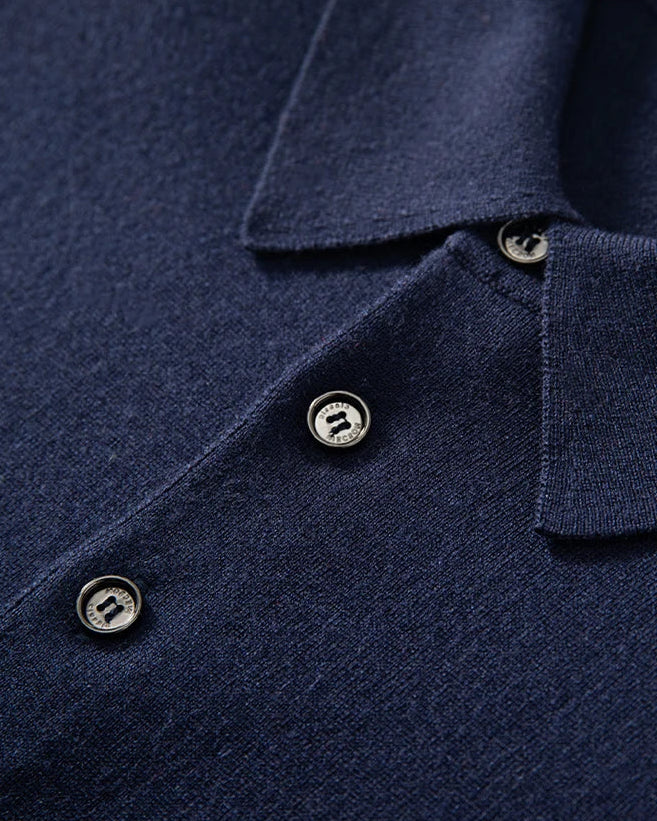Detail of the Midnight Express silk-cashmere polo — showing the placket and wide collar resting fluidly. From Borcelleclothes.
