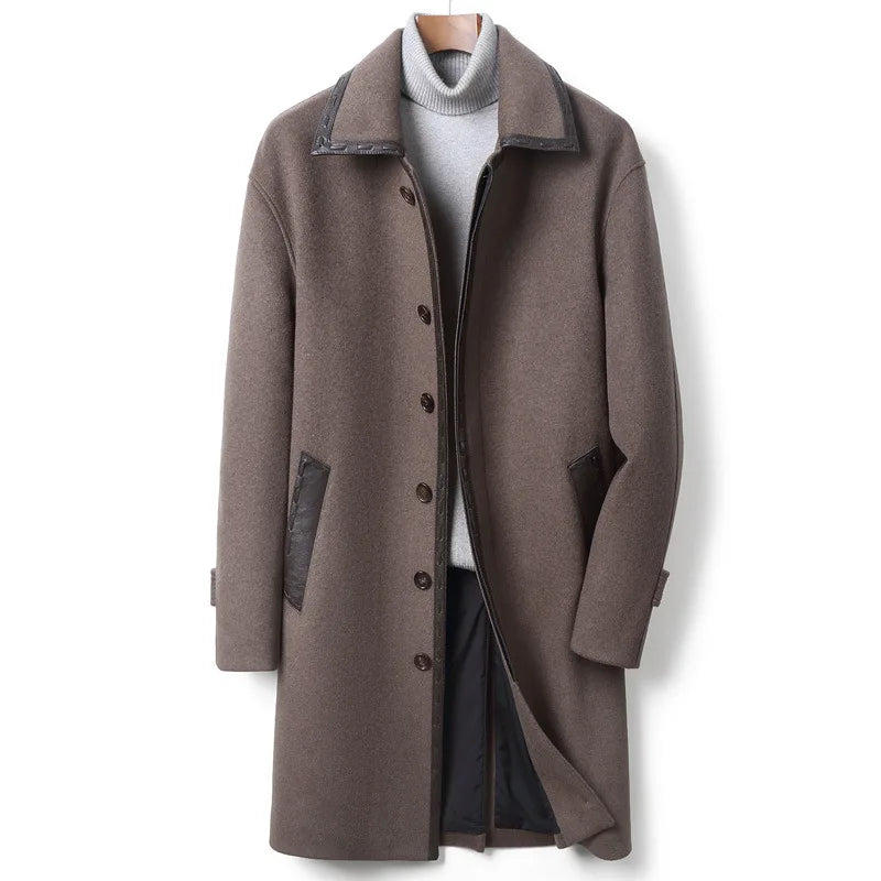 Men’s wool-cashmere coat with leather cord weaving in Falcon, pointed collar, concealed placket, raglan sleeves, and leather-trimmed pockets. From Borcelleclothes.