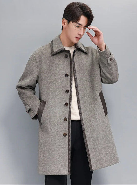 Men’s leather cord weaving wool coat in Mountain Mist, model adjusting glasses. From Borcelleclothes.