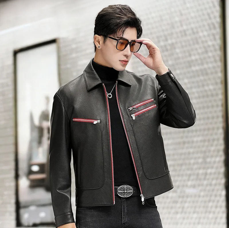 Model adjusting sunglasses while wearing a black goatskin leather jacket with Carmine Pink zipper accents — From Borcelleclothes.