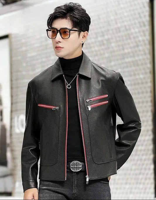 Model in a black goatskin leather jacket with Carmine Pink zipper accents, one hand placed behind the back — From Borcelleclothes.