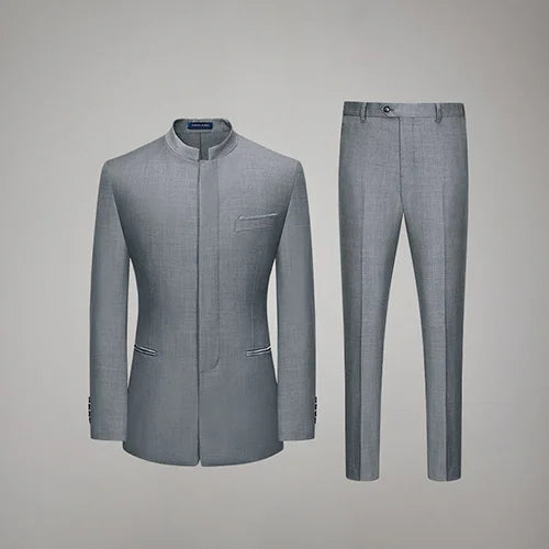 Men's Mandarin Collar Wool Ensemble in Oslo Grey, featuring a tailored silhouette with a sleek concealed placket, subtle satin accents, and straight-leg trousers for a modern, commanding look. From Borcelleclothes.