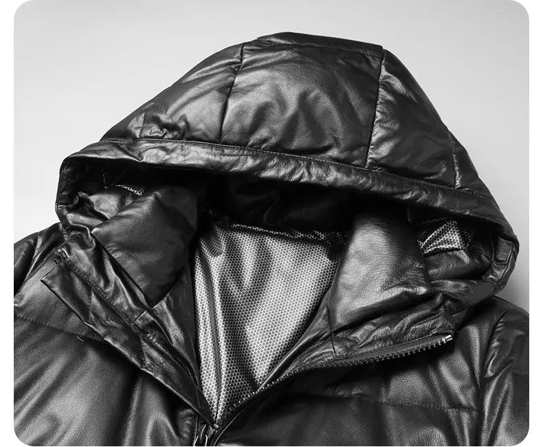 Detailed view of sculptural collar seamlessly integrated into the hood with drawcord and zip — From Borcelleclothes.