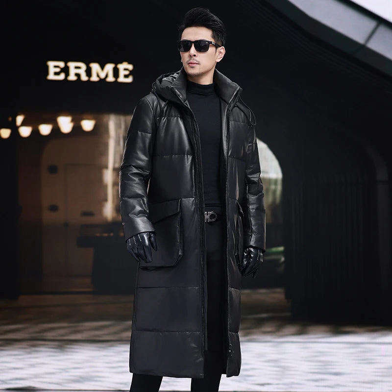 Men’s mid-calf cowhide down coat in Onyx with sculptural collar-hood, two-way zip, curved cargo pockets, and interior leather-trimmed pockets — From Borcelleclothes.