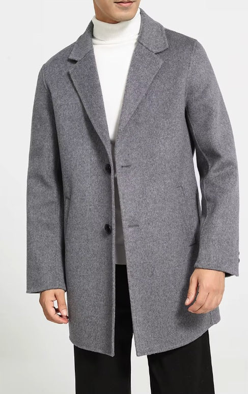 Men’s mid-length wool coat in Topaz, model standing with arms straight. From Borcelleclothes.