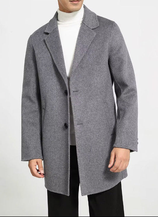 Men’s mid-length wool coat in Topaz, model standing with arms straight. From Borcelleclothes.