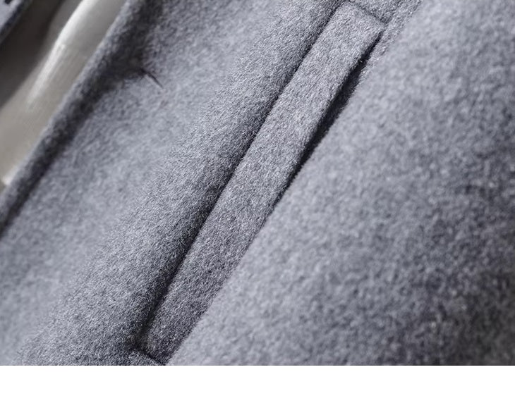 Side single-welt pocket detail of men’s mid-length wool coat in Topaz. From Borcelleclothes.
