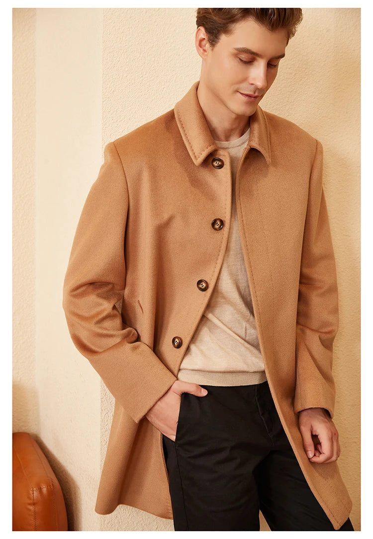 Model casually placing one hand in the pants pocket while wearing the Burning Sand cashmere coat, highlighting its relaxed sophistication and natural drape. From Borcelleclothes.