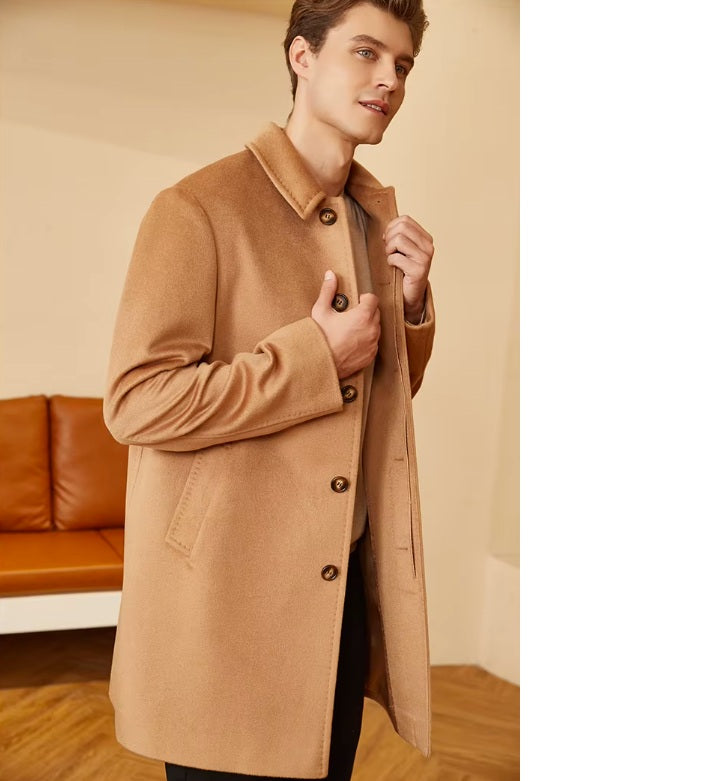 Side view of the Men’s Minimalist Cashmere Coat in Burning Sand, showing the coat’s clean lines and balanced proportions. From Borcelleclothes.