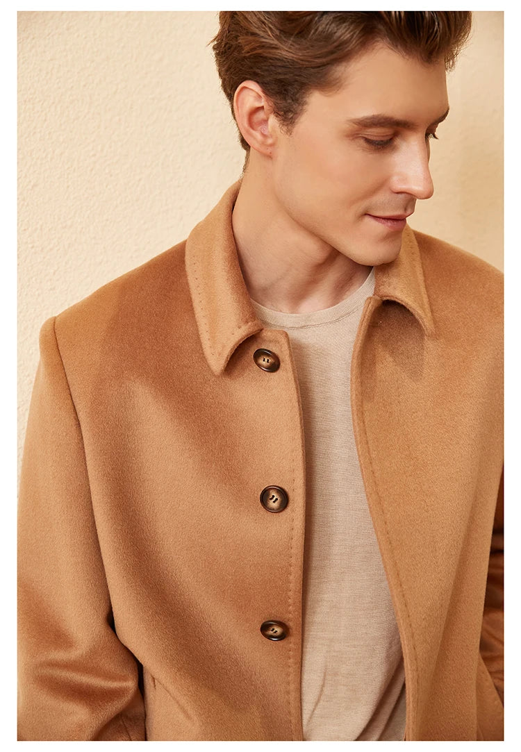 The Men’s Minimalist Cashmere Coat in Burning Sand, showcasing the structured set-in sleeves, notch lapels, and visible upper button. From Borcelleclothes.