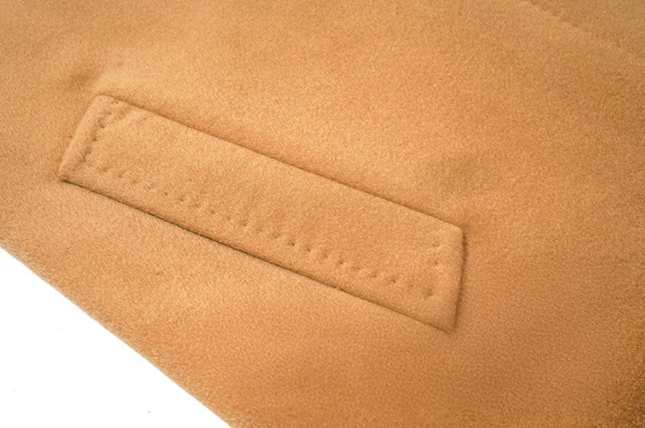 The welt pocket on the Men’s Minimalist Cashmere Coat in Burning Sand, highlighting the precise tailoring and clean aesthetic. From Borcelleclothes.