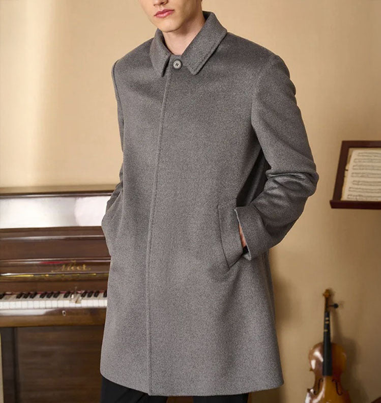 Men’s Minimalist Cashmere Coat in Harricane, crafted from a premium blend of 70% cashmere and 30% high-count wool. Featuring a sleek single-breasted design, structured set-in sleeves, and a refined visible upper button for a modern, minimalist aesthetic. From Borcelleclothes.
