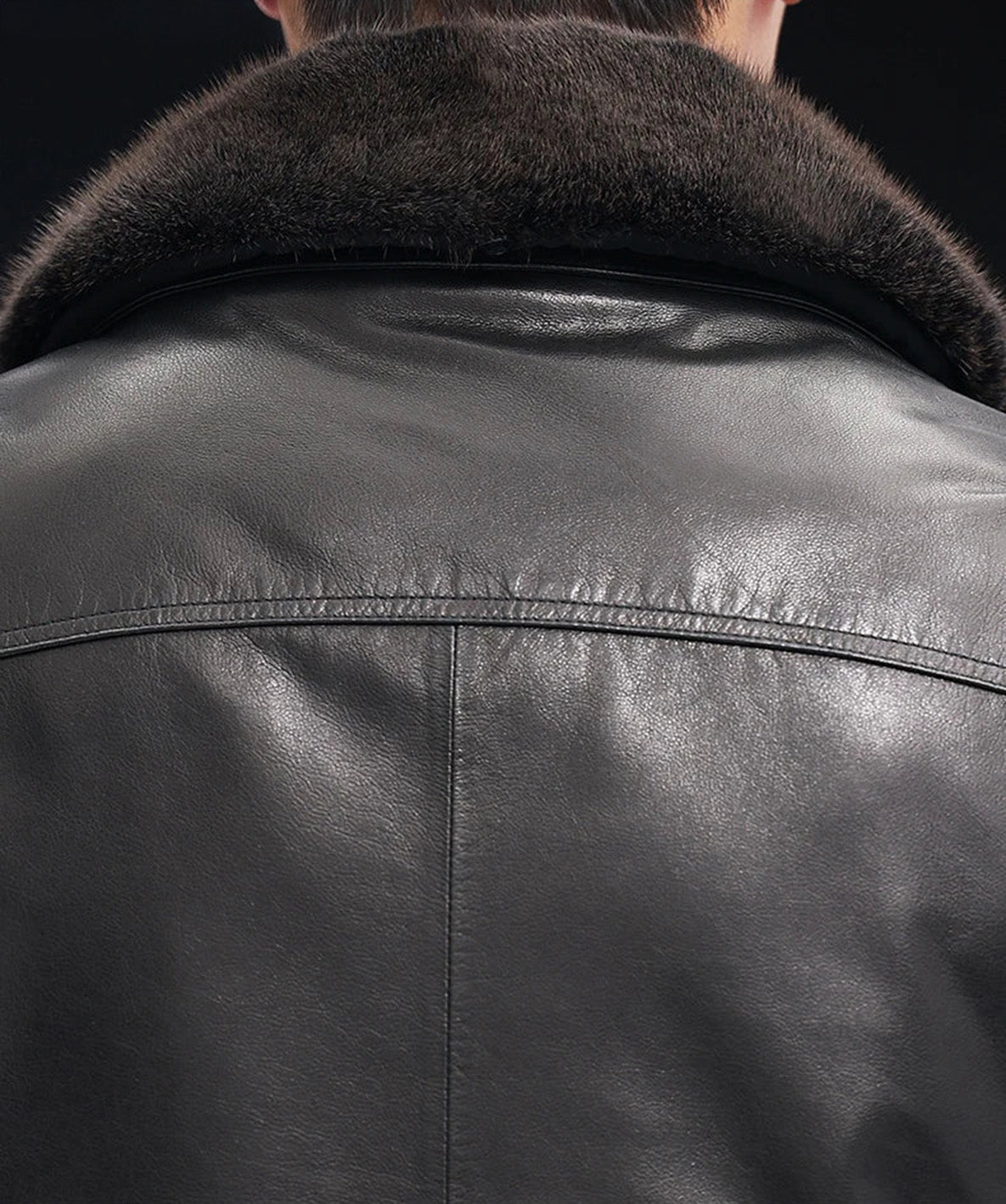 Back collar detail of goatskin jacket with mink trim in Onyx — From Borcelleclothes.